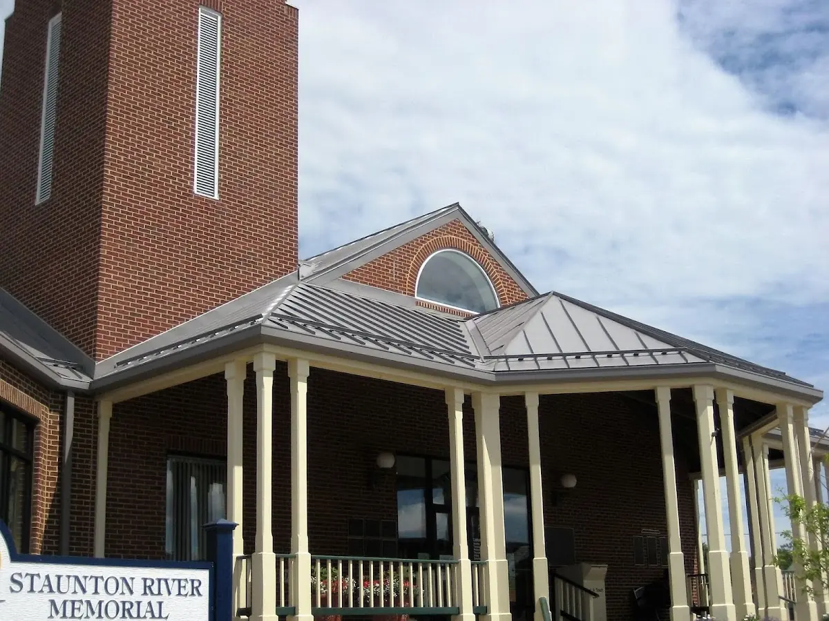 Skilled roofing craftsmen working on a residential roof in Lagrangeville